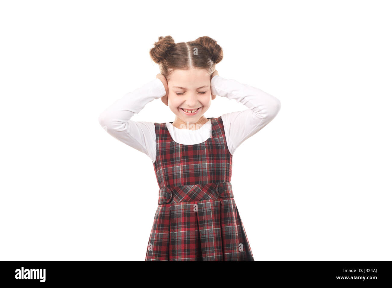 Fille de l'école couvrant ses oreilles Banque D'Images