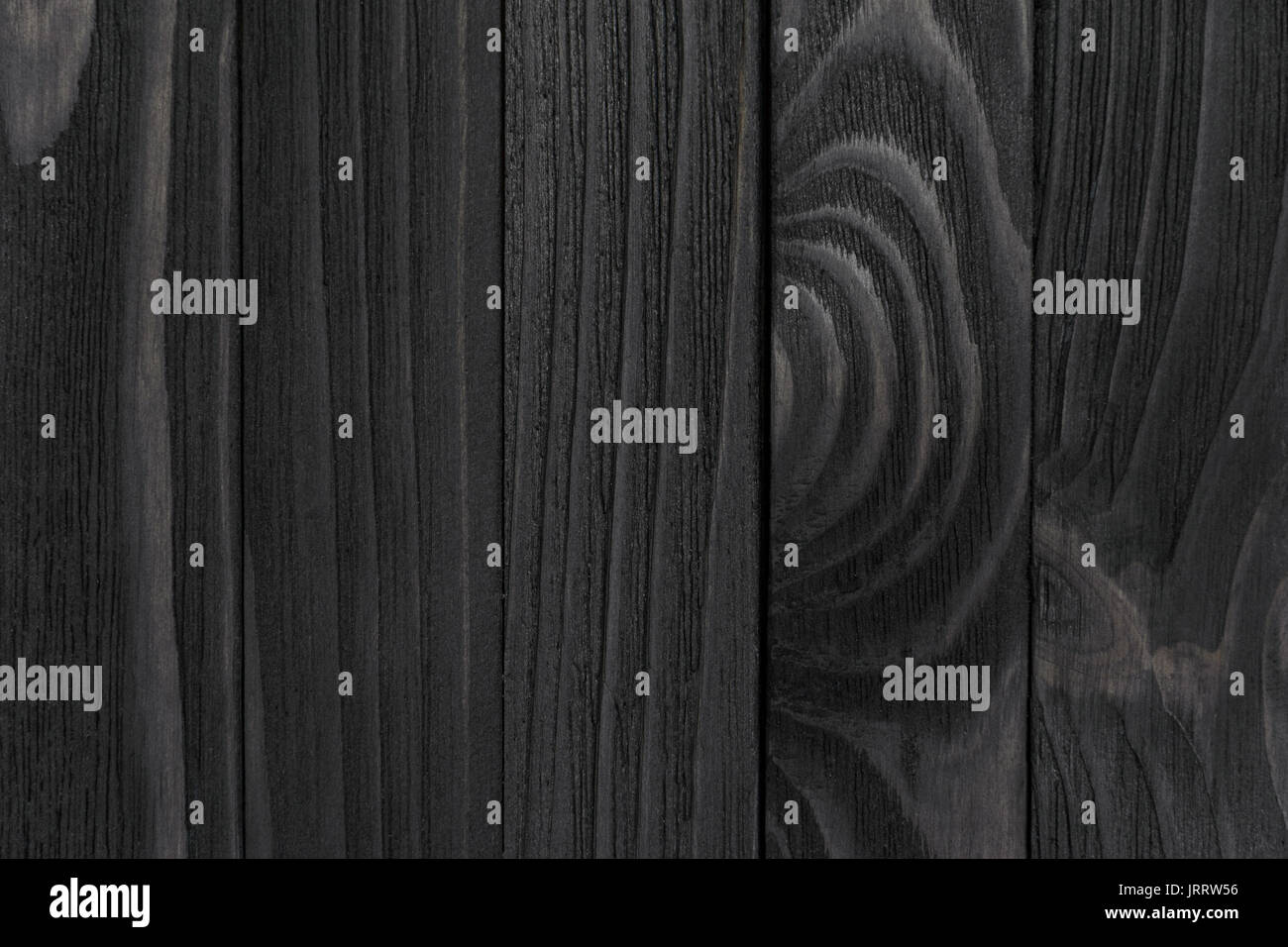 La texture du bois noir. Panneaux en bois teinté noir close-up. La  direction verticale des conseils cohérents. Vague de bois Photo Stock -  Alamy