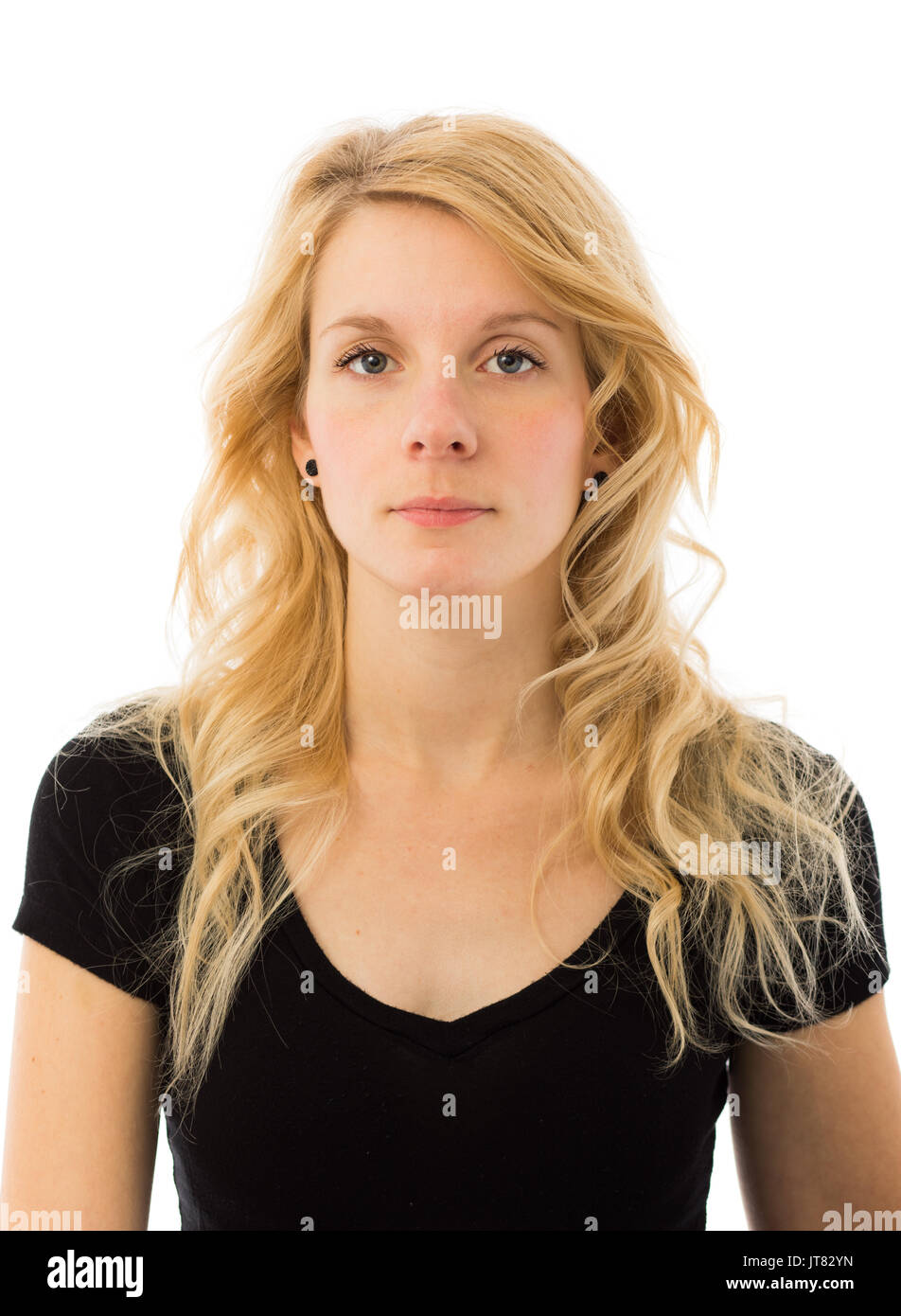 Pas d'émotion Portrait d'une jeune et belle blonde Woman isolé sur fond blanc Banque D'Images