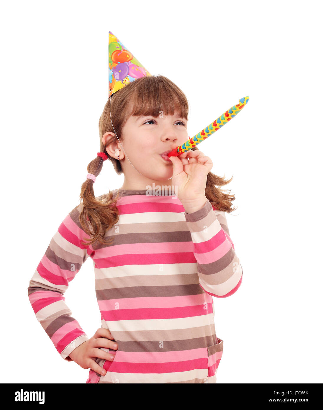 Happy little girl avec trompette d'anniversaire Photo Stock - Alamy