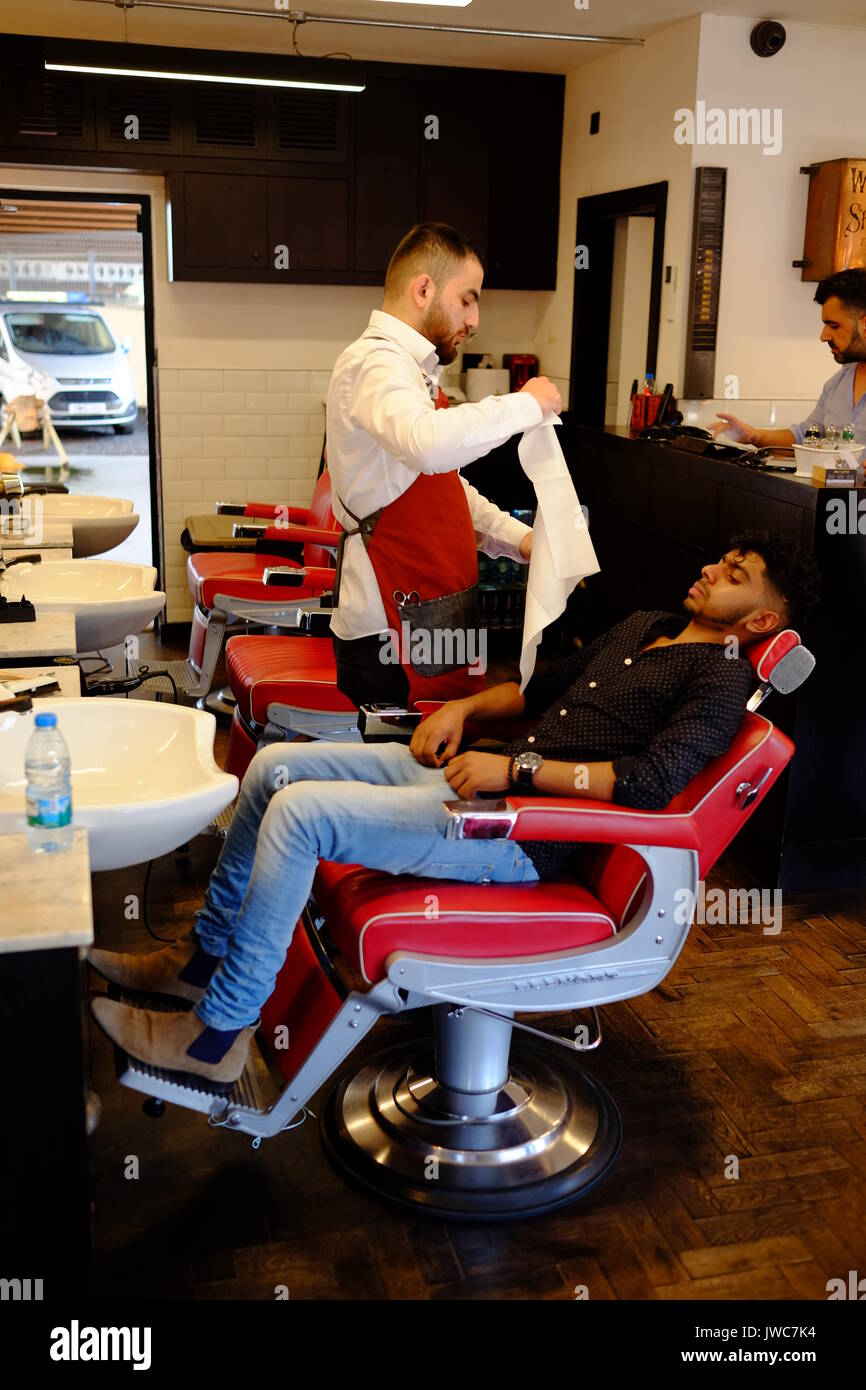 Un salon de coiffure à Brick Lane dans l'East End londonien Banque D'Images