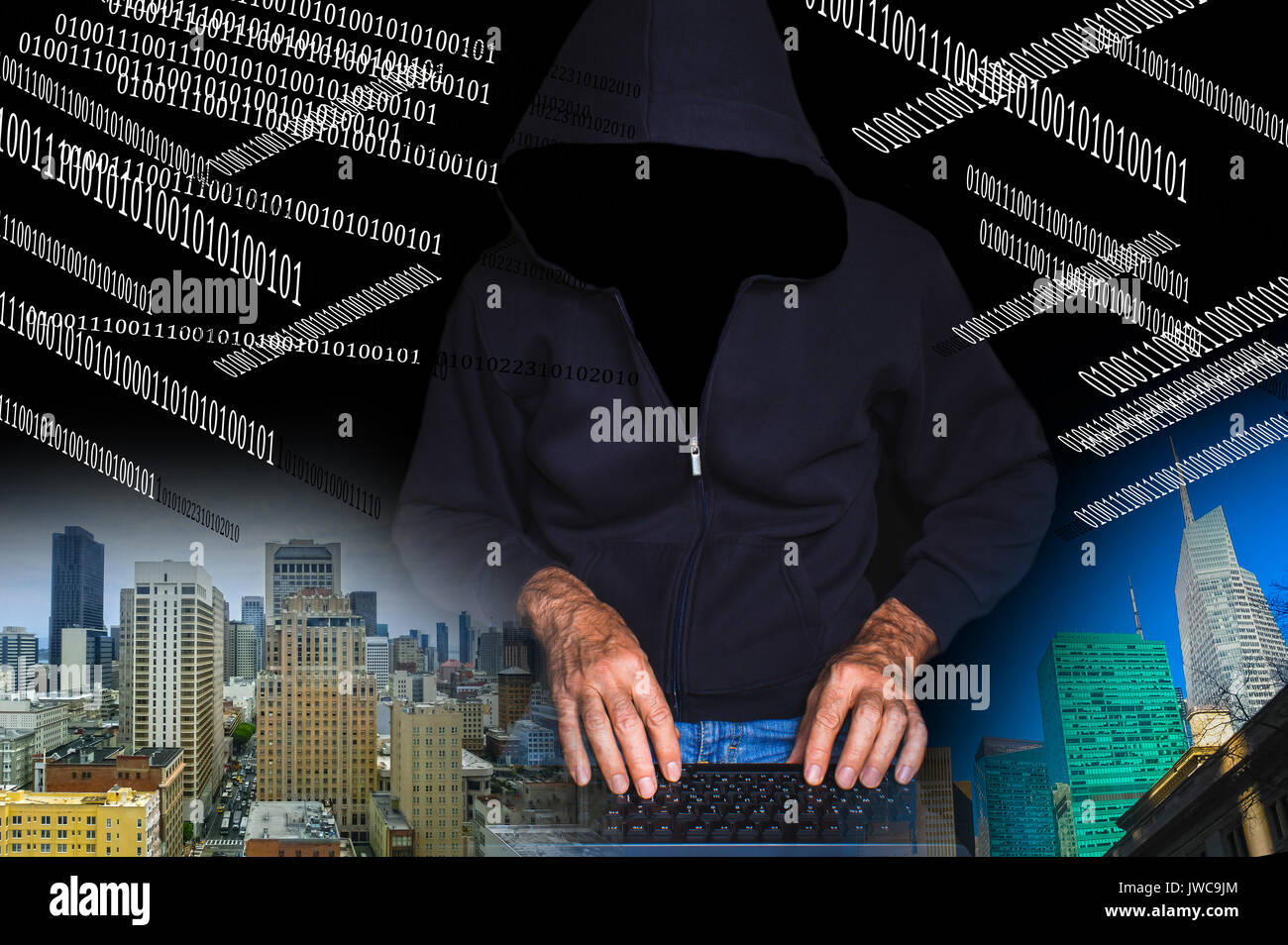 Hacker using laptop Banque D'Images