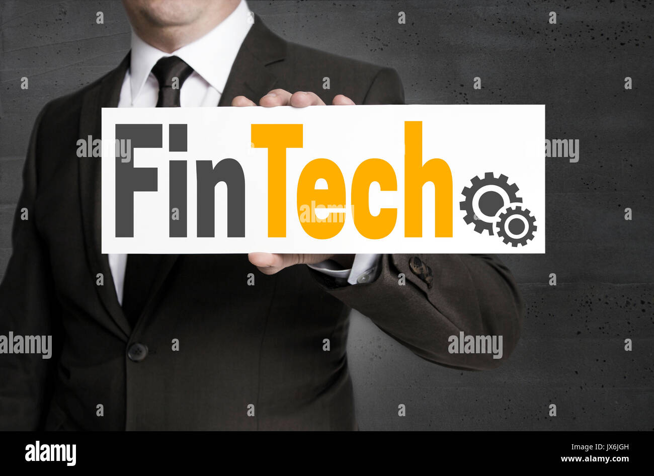 FinTech signe est tenu par l'homme d'affaires. Banque D'Images