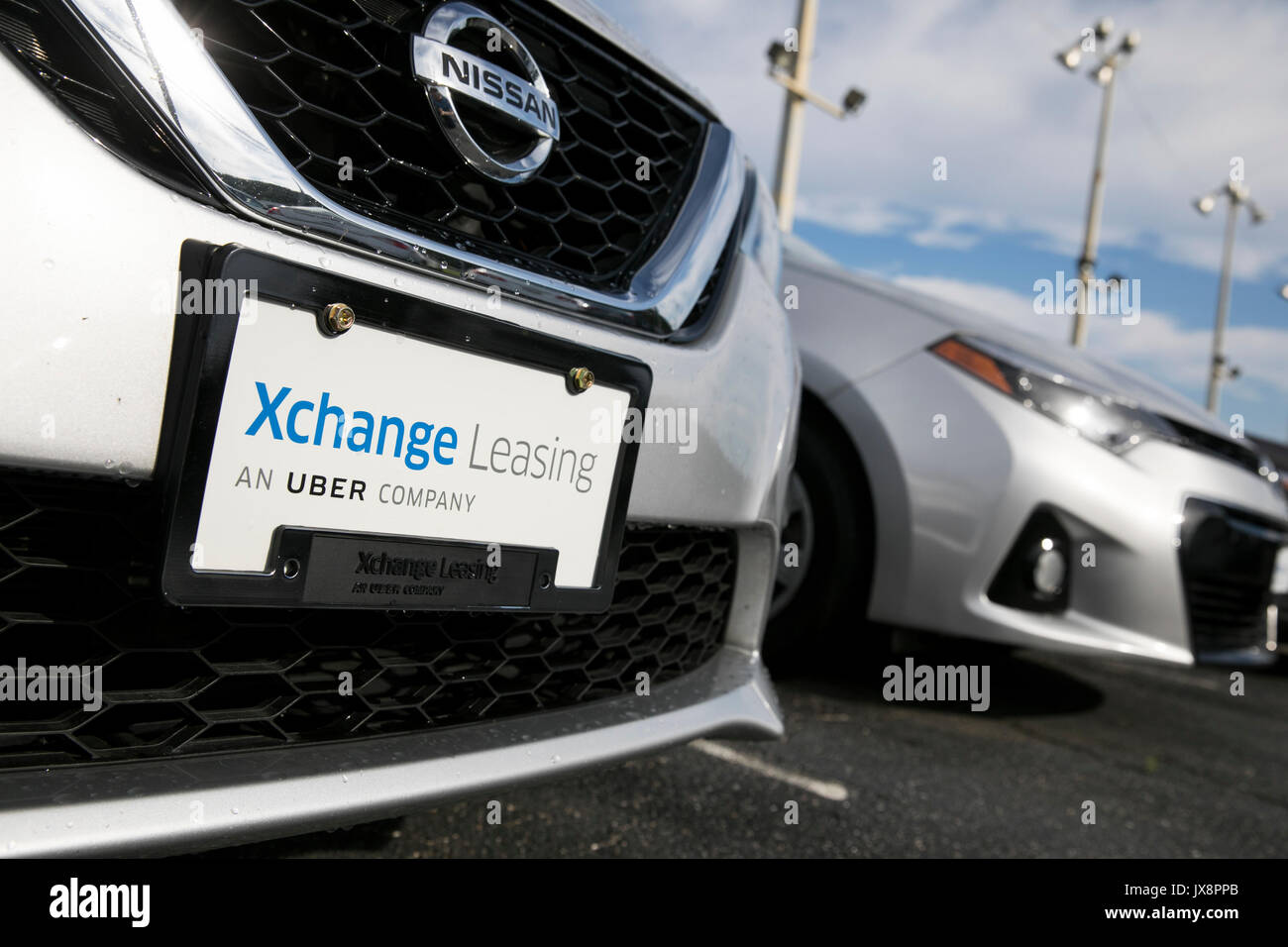 Signe d'un logo et de véhicules en dehors d'un établissement occupé par Xchange Leasing, une filiale de la société de covoiturage, Uber à Upper Marlboro, Maryland Banque D'Images