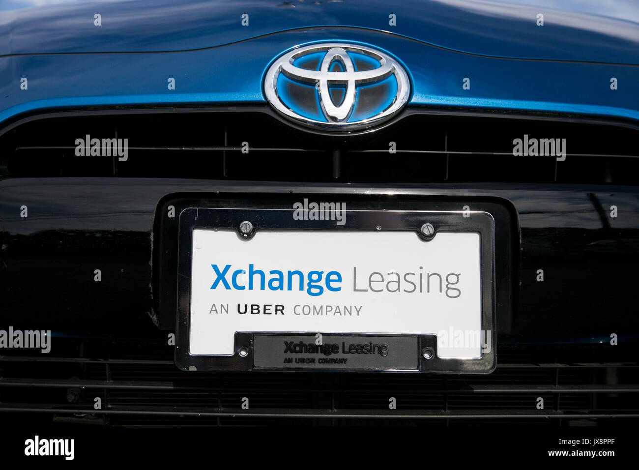 Signe d'un logo et de véhicules en dehors d'un établissement occupé par Xchange Leasing, une filiale de la société de covoiturage, Uber à Upper Marlboro, Maryland Banque D'Images