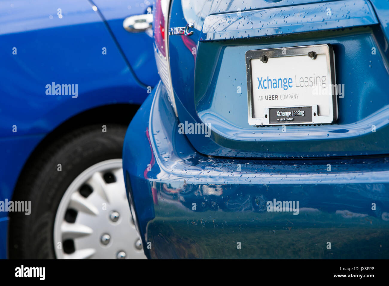 Signe d'un logo et de véhicules en dehors d'un établissement occupé par Xchange Leasing, une filiale de la société de covoiturage, Uber à Upper Marlboro, Maryland Banque D'Images