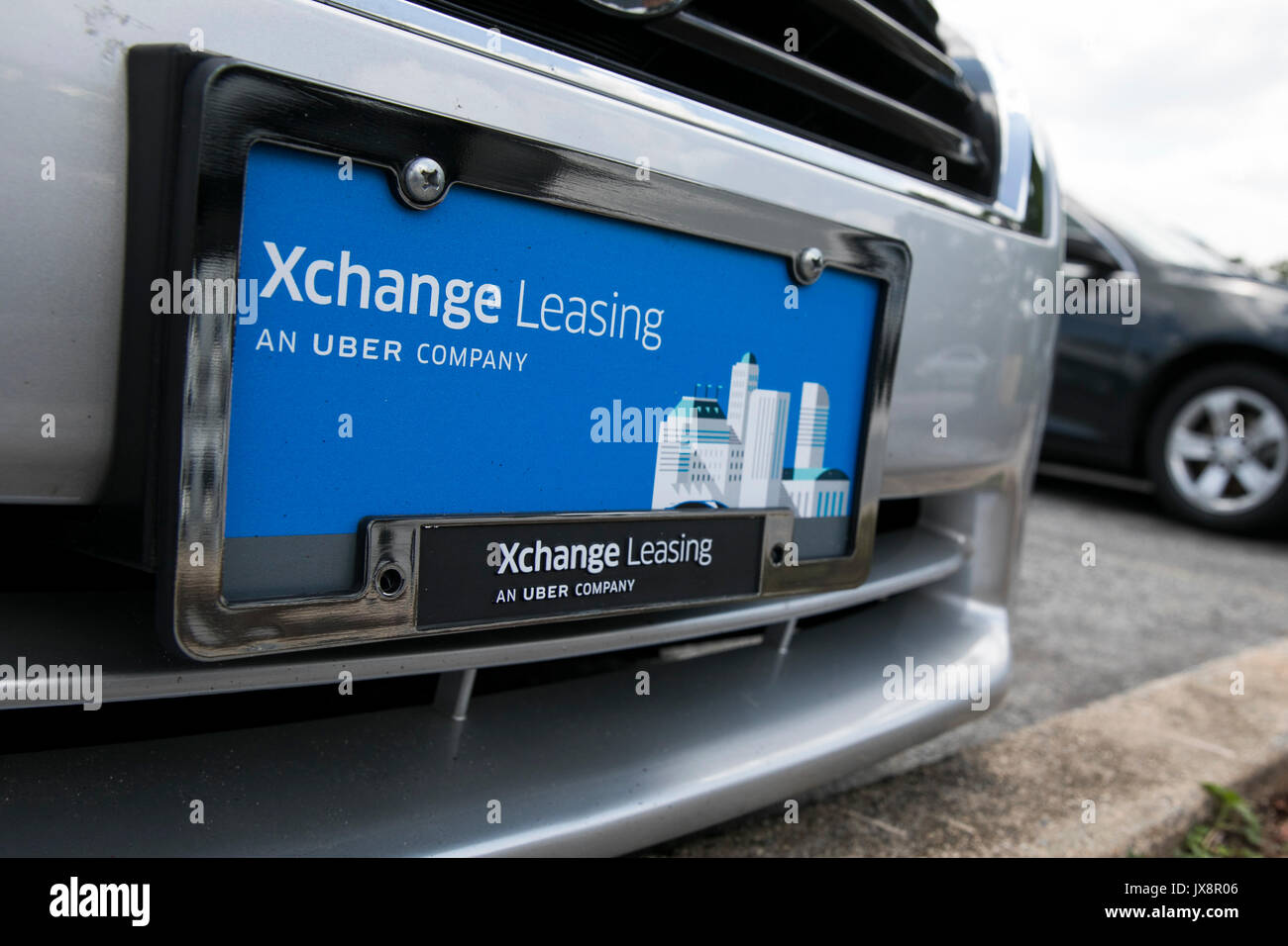 Signe d'un logo et de véhicules en dehors d'un établissement occupé par Xchange Leasing, une filiale de la société de covoiturage, Uber à Nottingham, Maryland sur une Banque D'Images