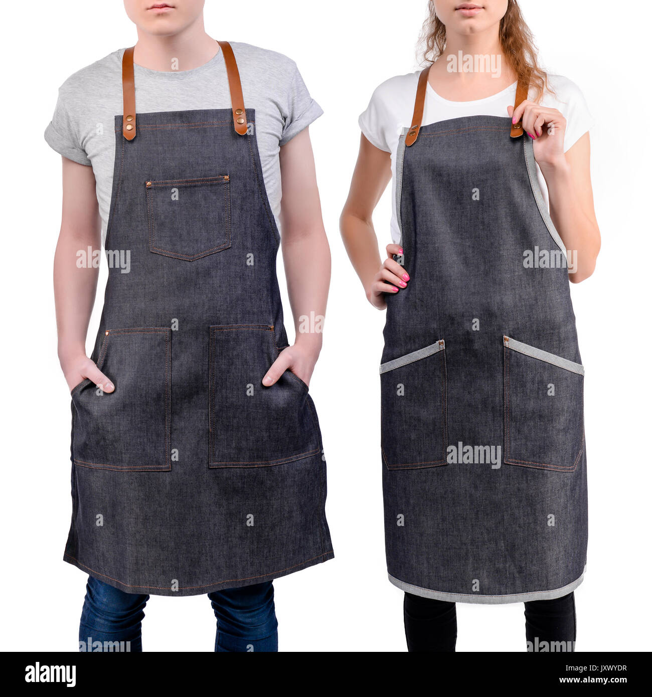 Jeunes chefs ou maîtres d'homme et de la femme pose, portant des tabliers isolé sur fond blanc. Café café barista uniforme. Banque D'Images