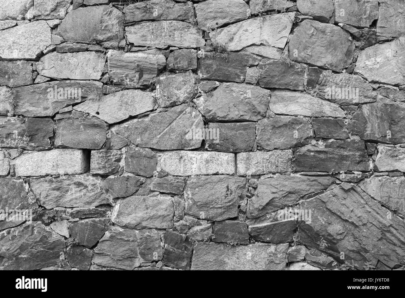Close-up d'un vieux mur à une forteresse faite de pierres en noir et blanc. Banque D'Images Close-up d'un vieux mur à une forteresse faite de pierres en noir et blanc. Banque D'Images