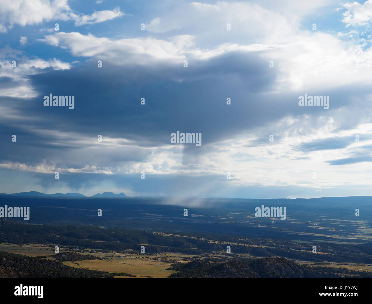Gathering clouds. A storm brewing with developing cumulus nimbus clouds. |  CanStock
