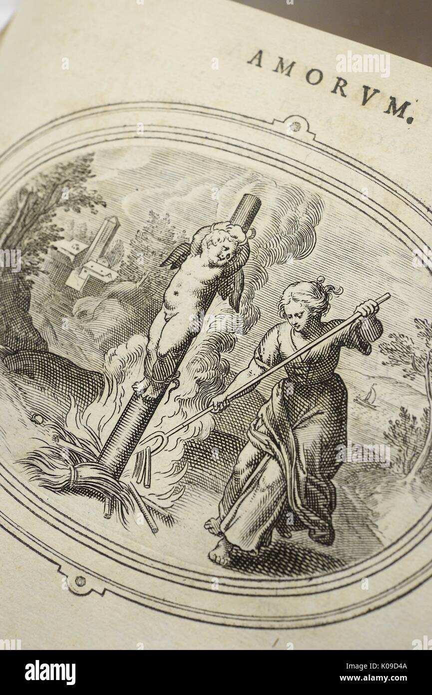 Illustration d'un enfant nu avec des ailes attachées à un grand pôle, une femme tient une fourche et déménagement autour du poteau où un incendie a été défini, le 11 février 2015. Banque D'Images