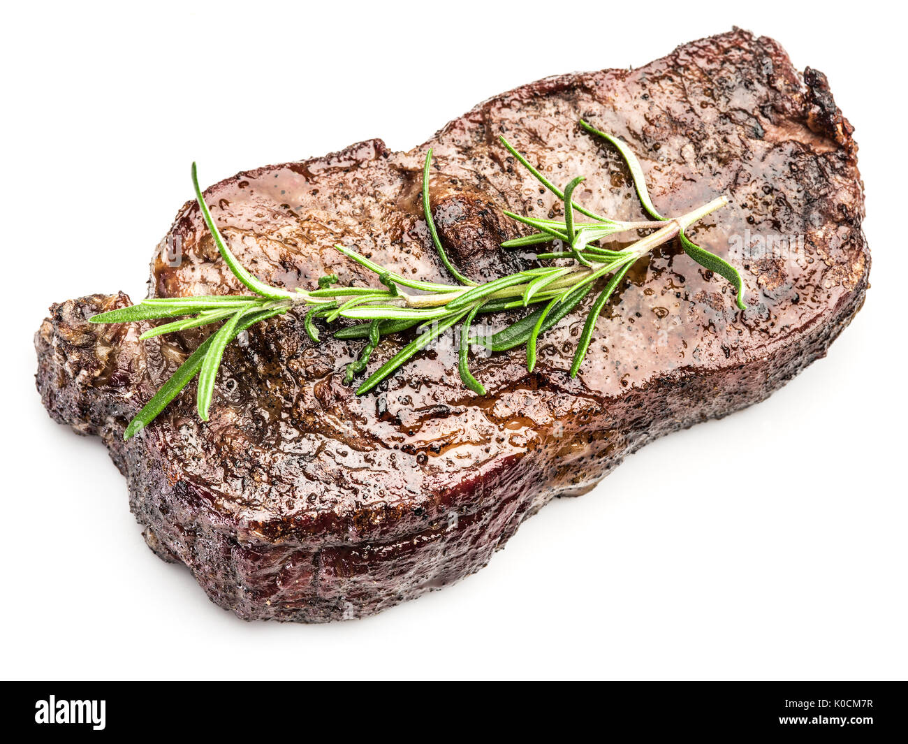 Ribeye Steak aux épices sur le fond blanc. Banque D'Images