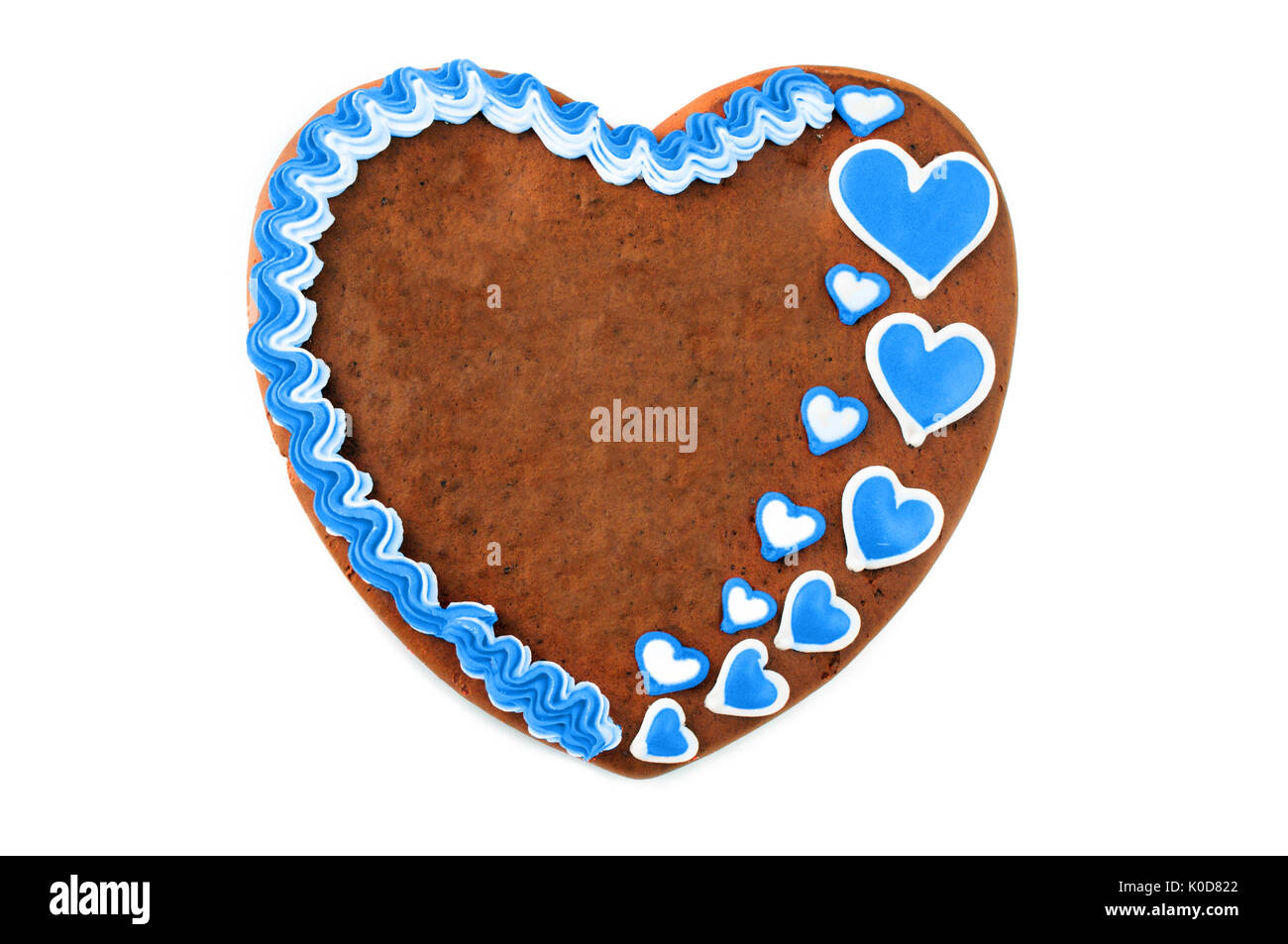 Oktoberfest gingerbread heart cake with copy space sur blanc fond isolé Banque D'Images