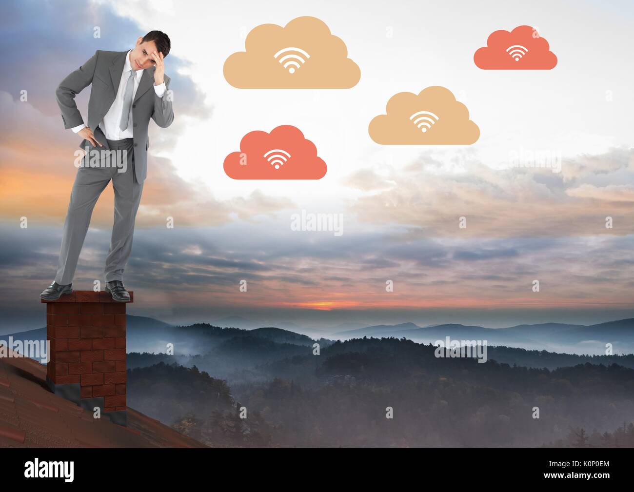 Digital composite of cloud Télécharger Icones et businessman standing on Roof avec cheminée et misty paysage ciel coloré Banque D'Images