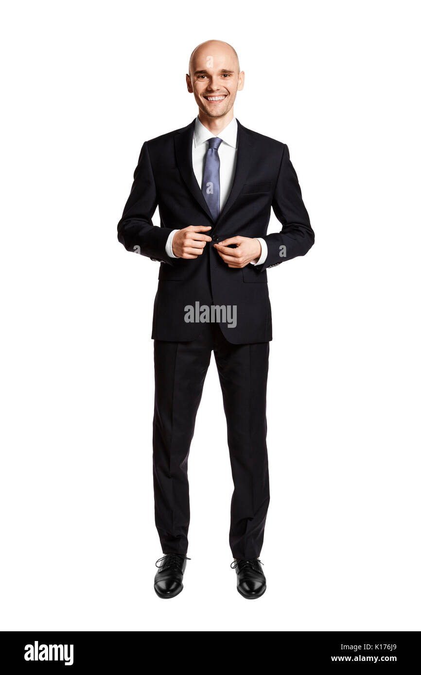 Studio shot of young smiling man getting ready isolé sur fond blanc. Banque D'Images