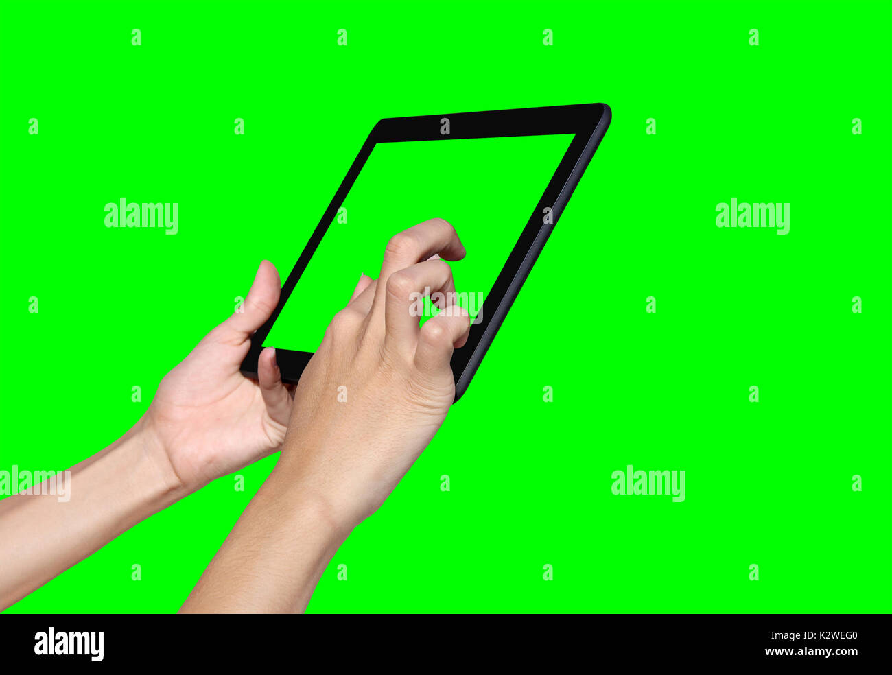 Femme d'affaires à l'aide d'un ordinateur tablette sur un écran vert Banque D'Images