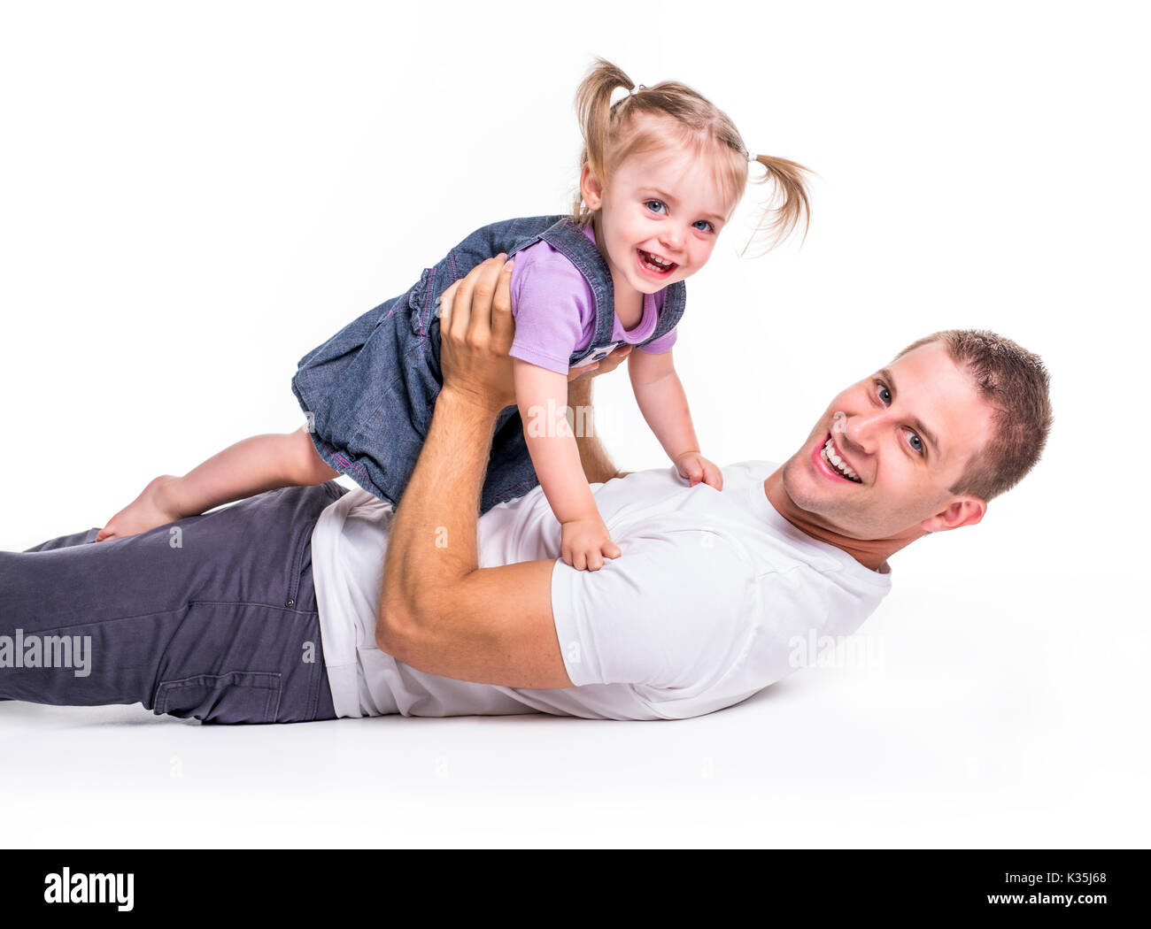 Un père et fille s'est retrouvée sur le sol s'amusant Banque D'Images
