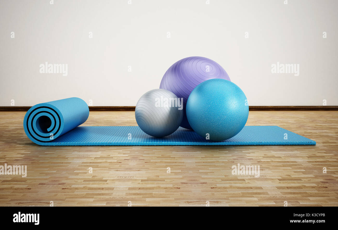 Tapis de pilates et de ballons d'exercice debout sur parquet. 3d illustration. Banque D'Images