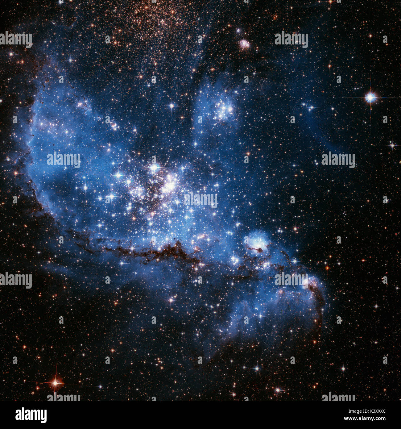 Le Petit Nuage de Magellan est une galaxie irrégulière naine près de la Voie Lactée, situé à 210 000 années-lumière. Image couleurs retouchées. Éléments de cette Banque D'Images