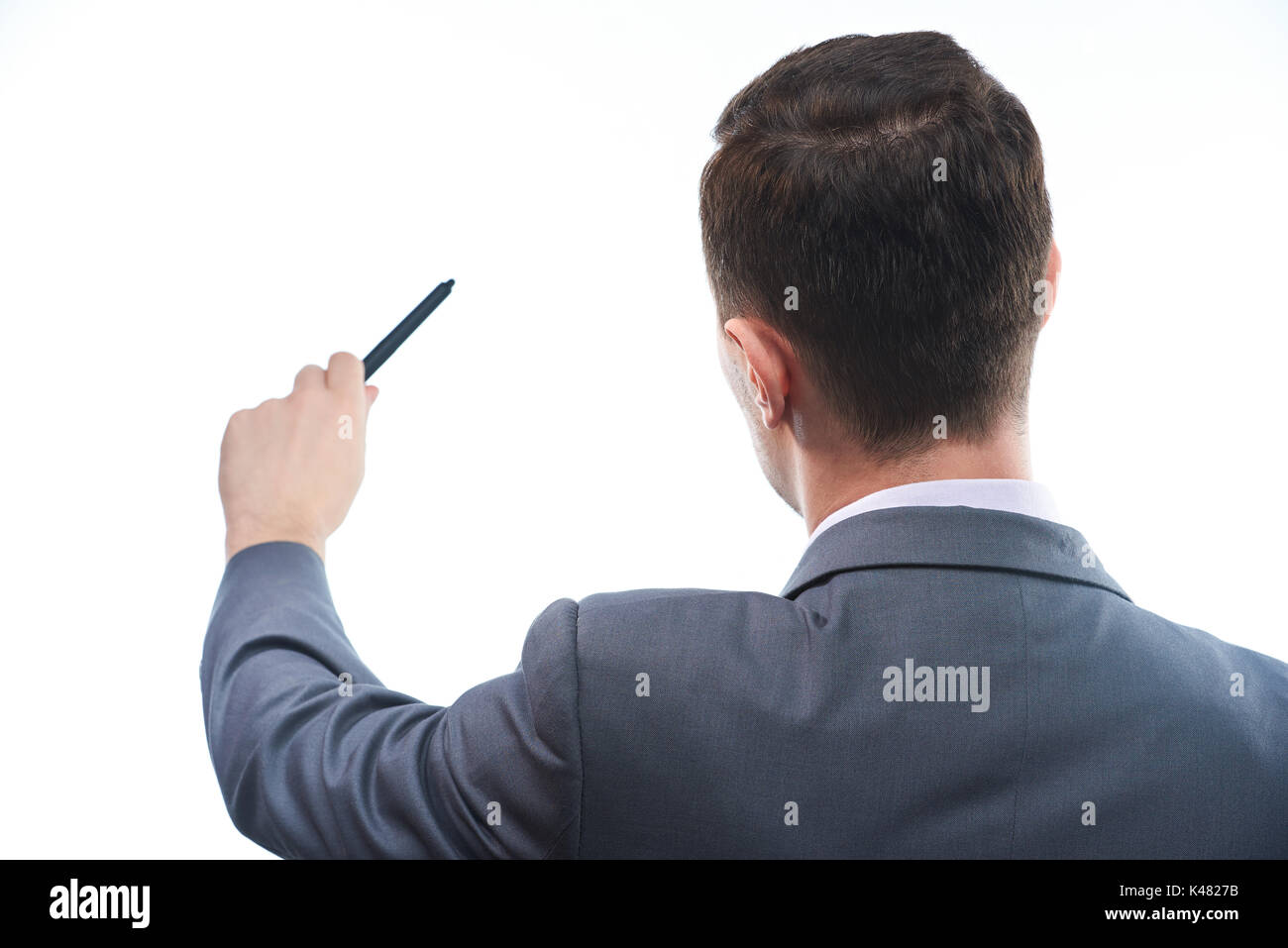 Business man pointing with pen Vue de dos close-up isolated Banque D'Images