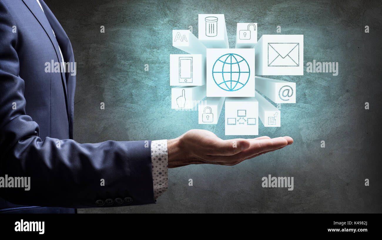 Businessman présent glaçons avec des icônes sur la main. Banque D'Images