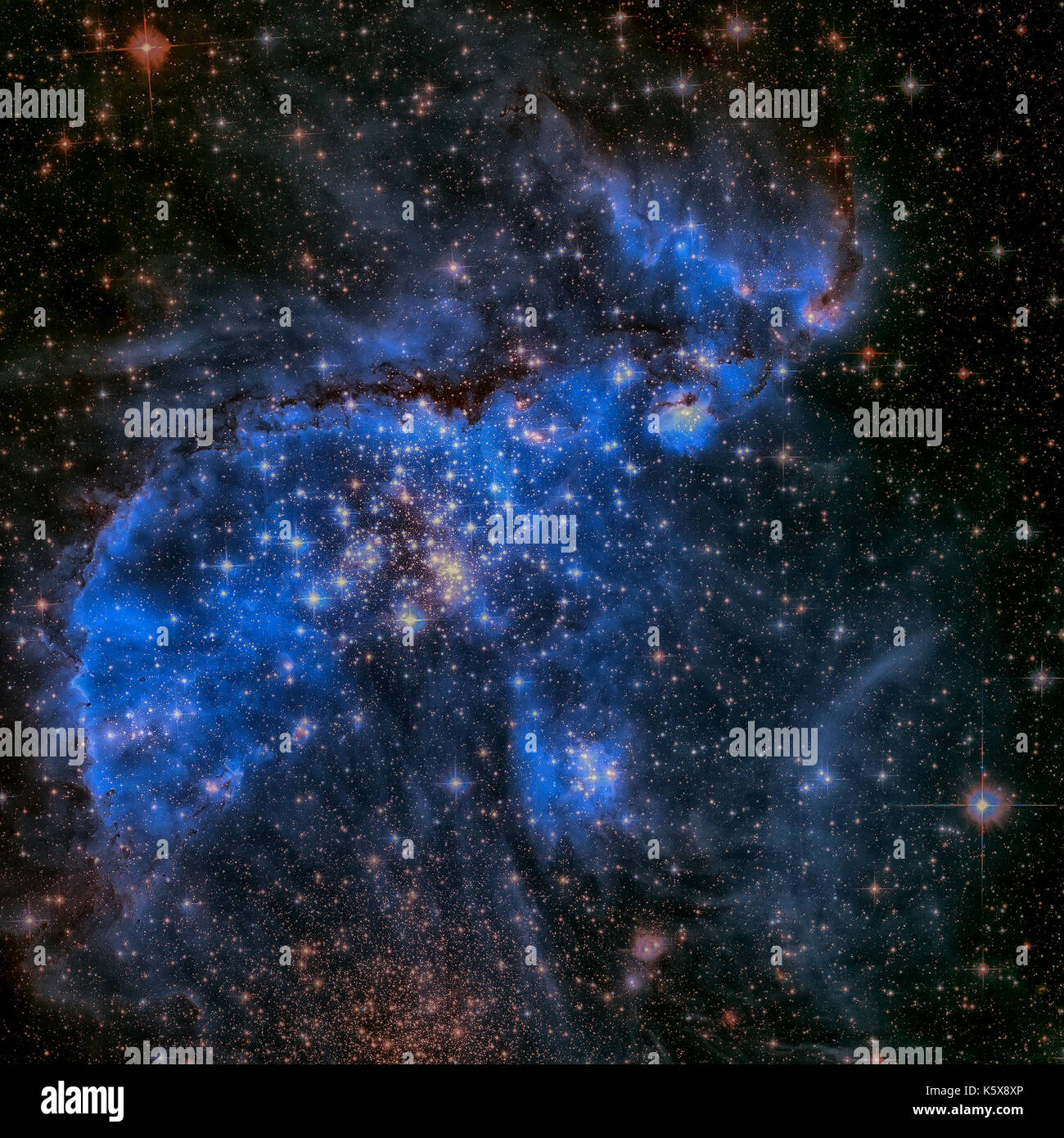 Le Petit Nuage de Magellan est une galaxie irrégulière naine près de la Voie Lactée, situé à 210 000 années-lumière. Image couleurs retouchées. Éléments de cette Banque D'Images