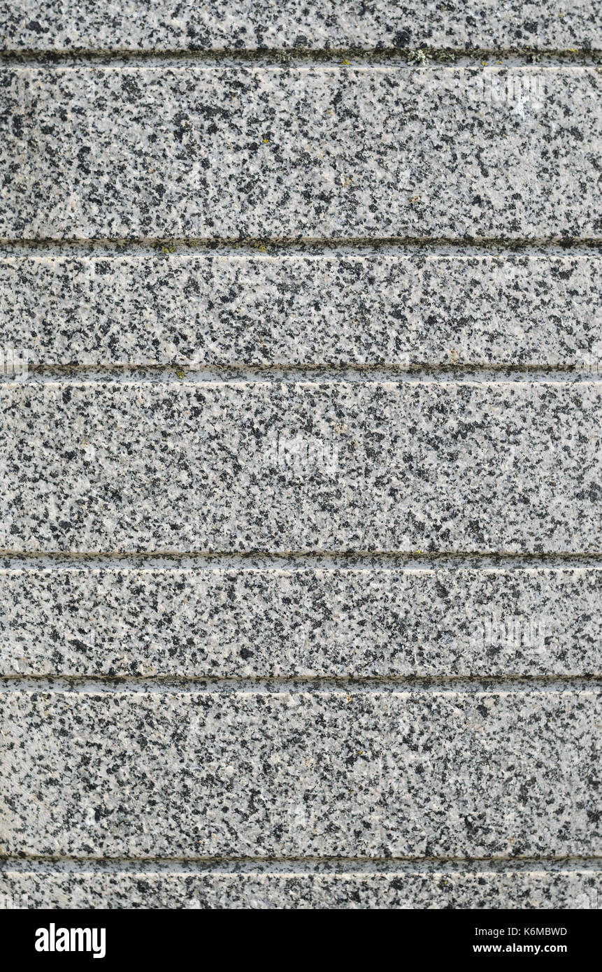 Texture granit gris avec rainures décoratives parallèle. qu'un mur en pierre naturelle matériau de finition Banque D'Images