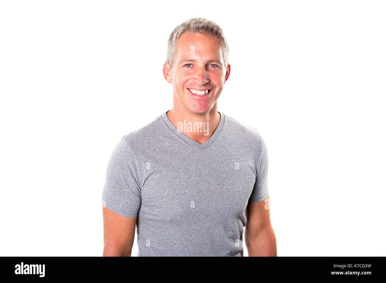 Portrait of young man standing on white background Banque D'Images