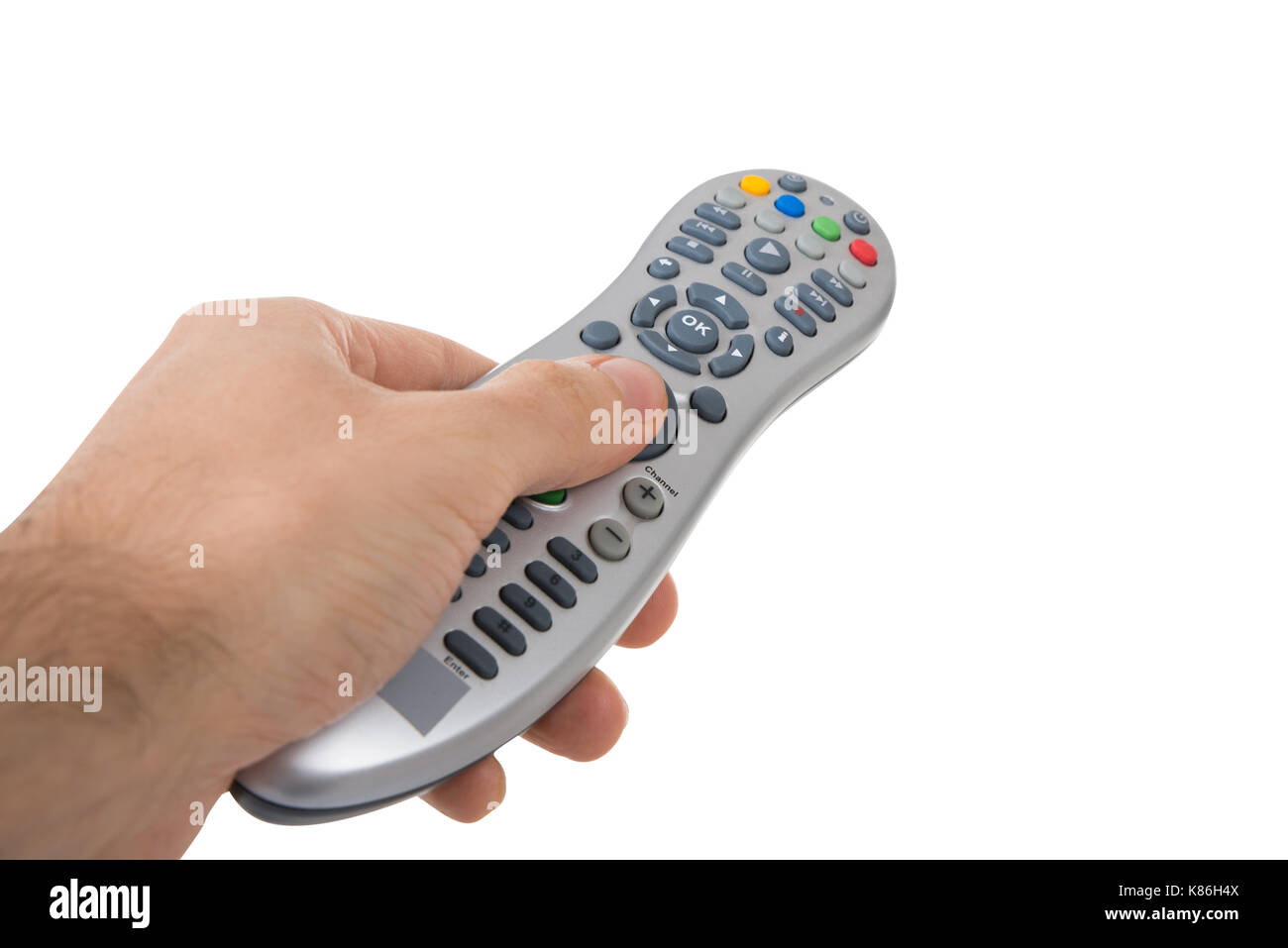 Cropped hand holding remote control against white background Banque D'Images