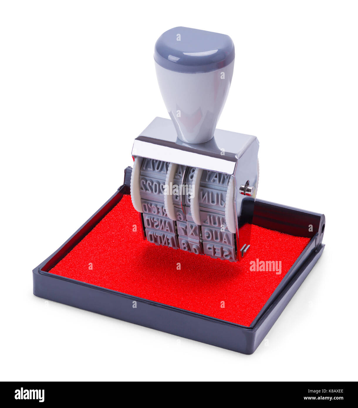 Date stamper sur tampon encreur rouge isolé sur fond blanc. Banque D'Images