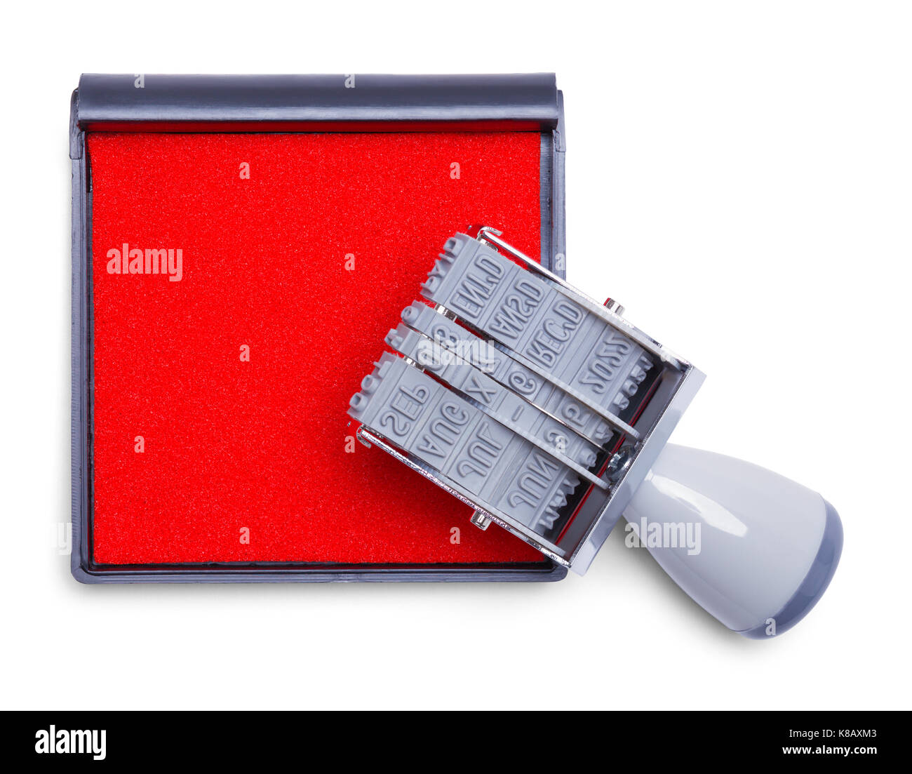 Date stamper en caoutchouc gris et tampon encreur isolé sur fond blanc. Banque D'Images