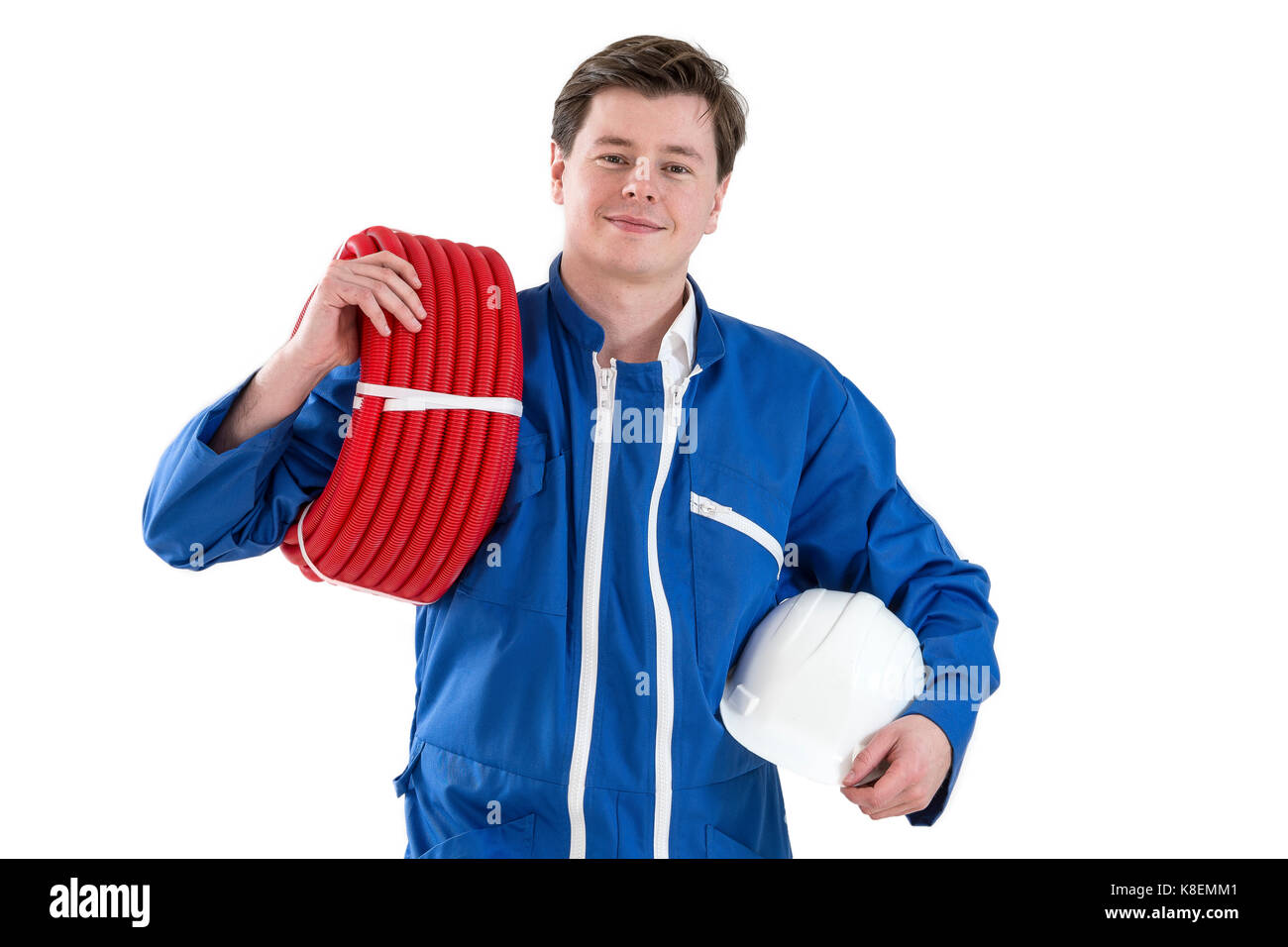 Portrait of smiling woman holding réparateur rouleau fil in bright office Banque D'Images