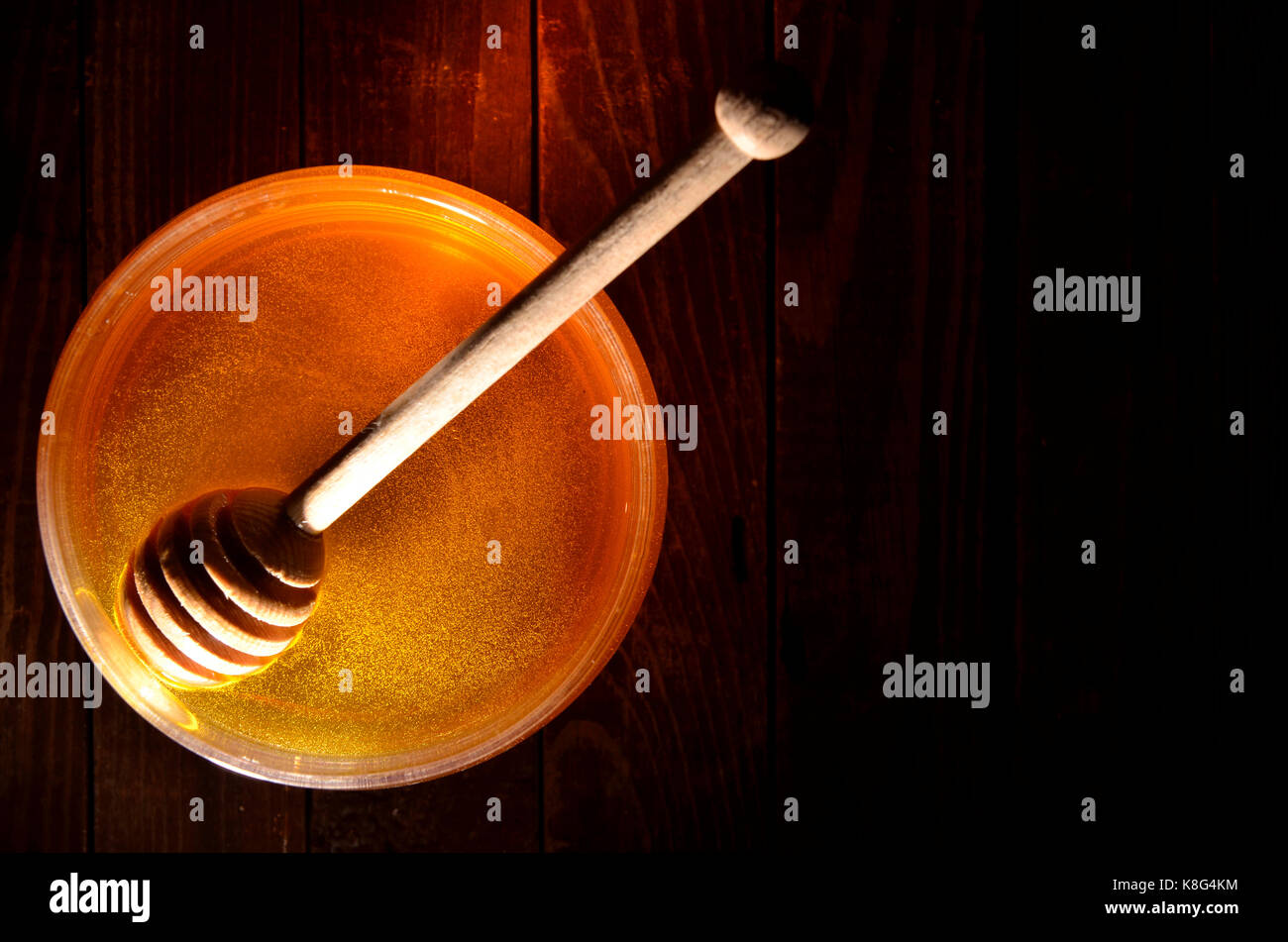 Pot de miel et stick pour le miel Banque D'Images