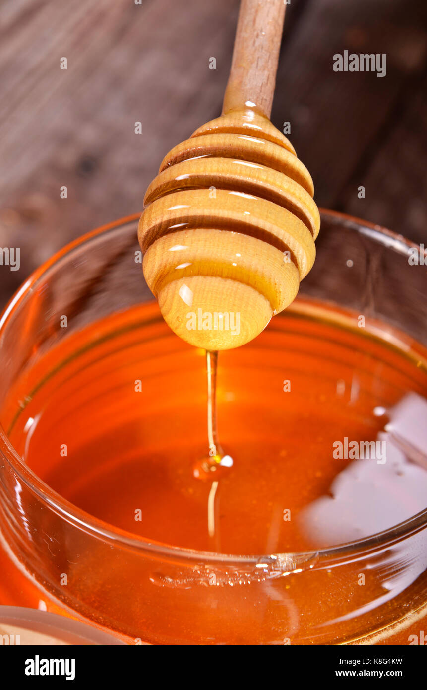 Pot de miel et stick pour le miel Banque D'Images