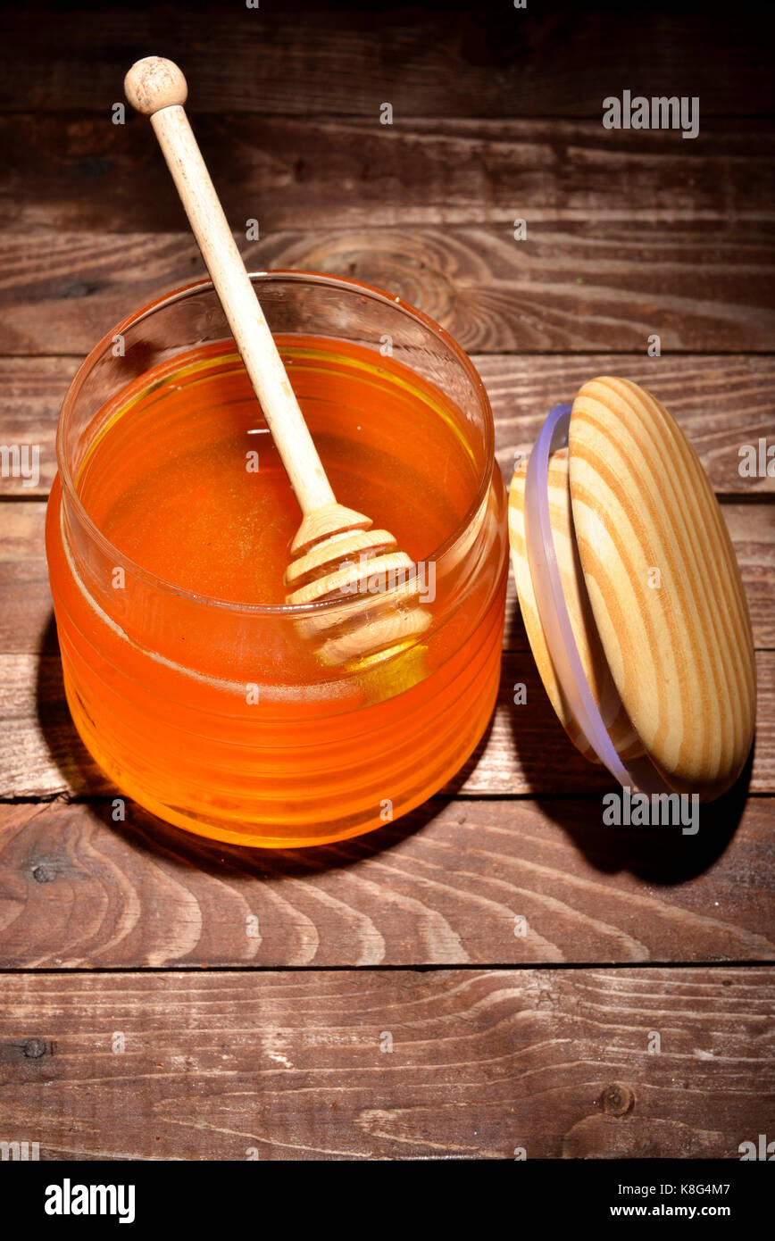 Pot de miel et stick pour le miel Banque D'Images