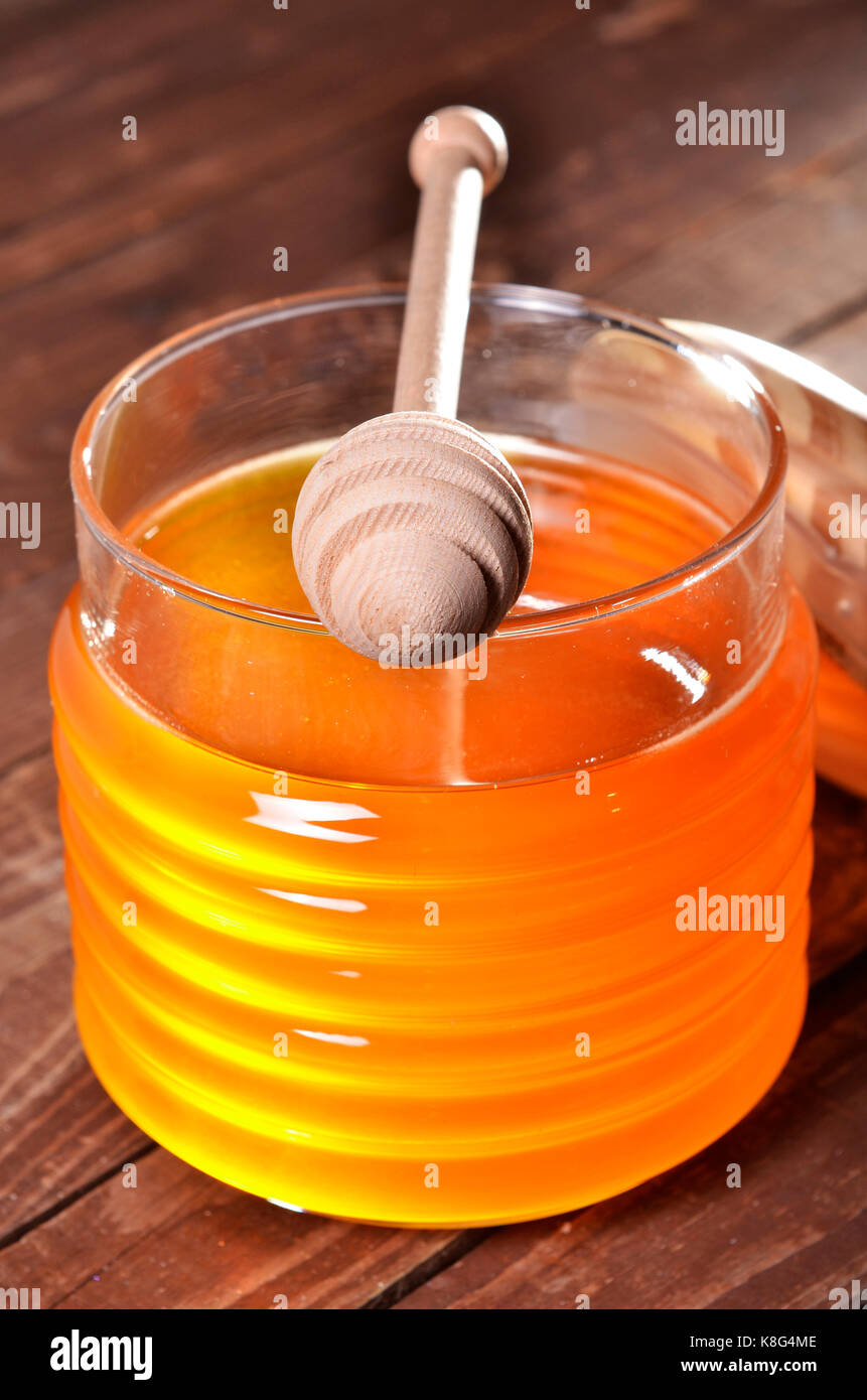 Pot de miel et stick pour le miel Banque D'Images