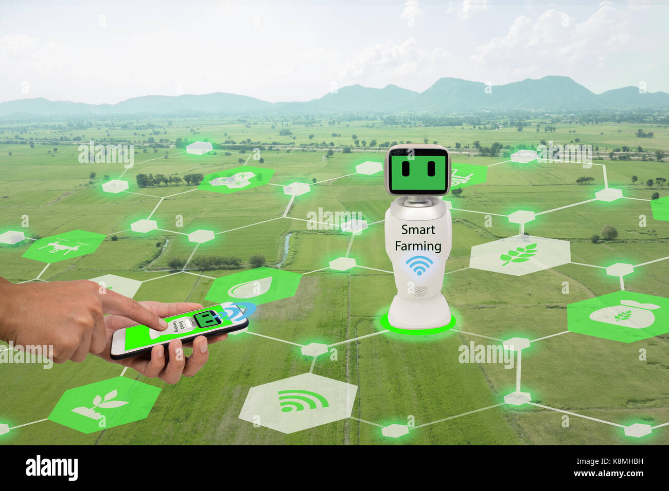 Iot, internet des choses,l'agriculture concept.agriculteur utiliser mobile phone connect robotique intelligente (intelligence artificielle,ai) pour utiliser le contrôle de gestion , , Banque D'Images