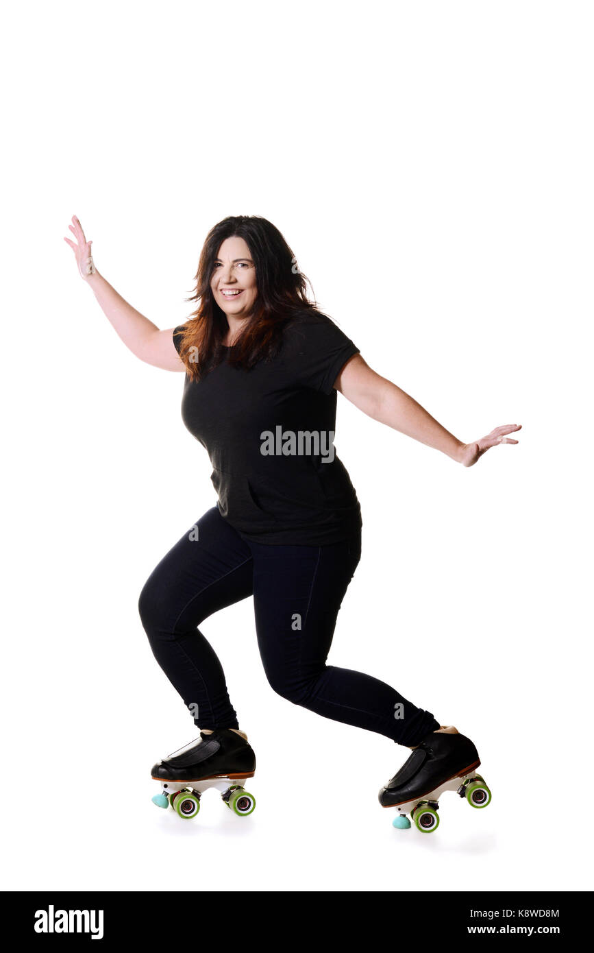 Woman having fun sur patins à roulettes quad Banque D'Images