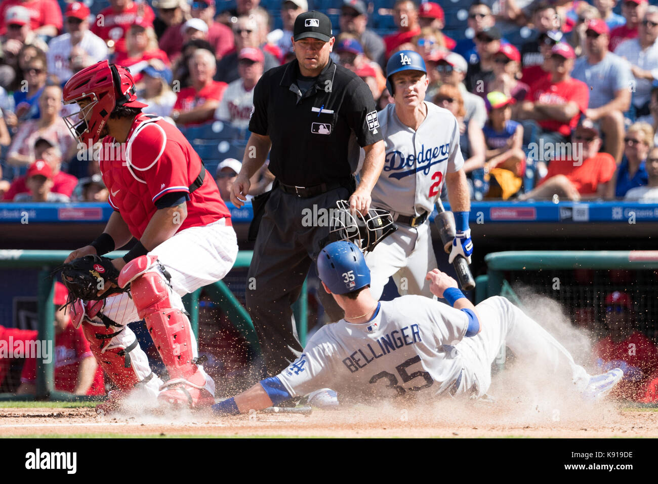 Los Angeles Dodgers' Cody Bellinger is welcomed home by teammates Chris  Taylor and Corey Seager after hitting a mammoth three-run shot to right  field n the third inning, his 39th homer of