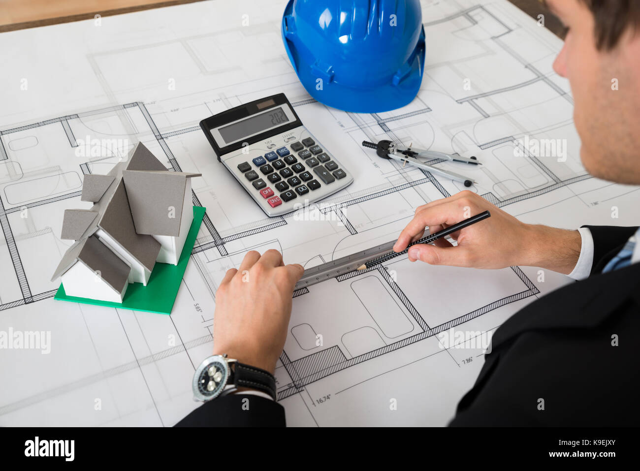 Close-up of male architect working on in office Banque D'Images