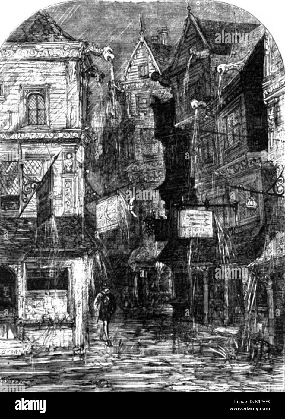 Scène de rue à Londres un jour de pluie sous le règne de la reine Elizabeth, capturant les piétons, l'architecture et les rues pavées humides sous des parapluies. Banque D'Images