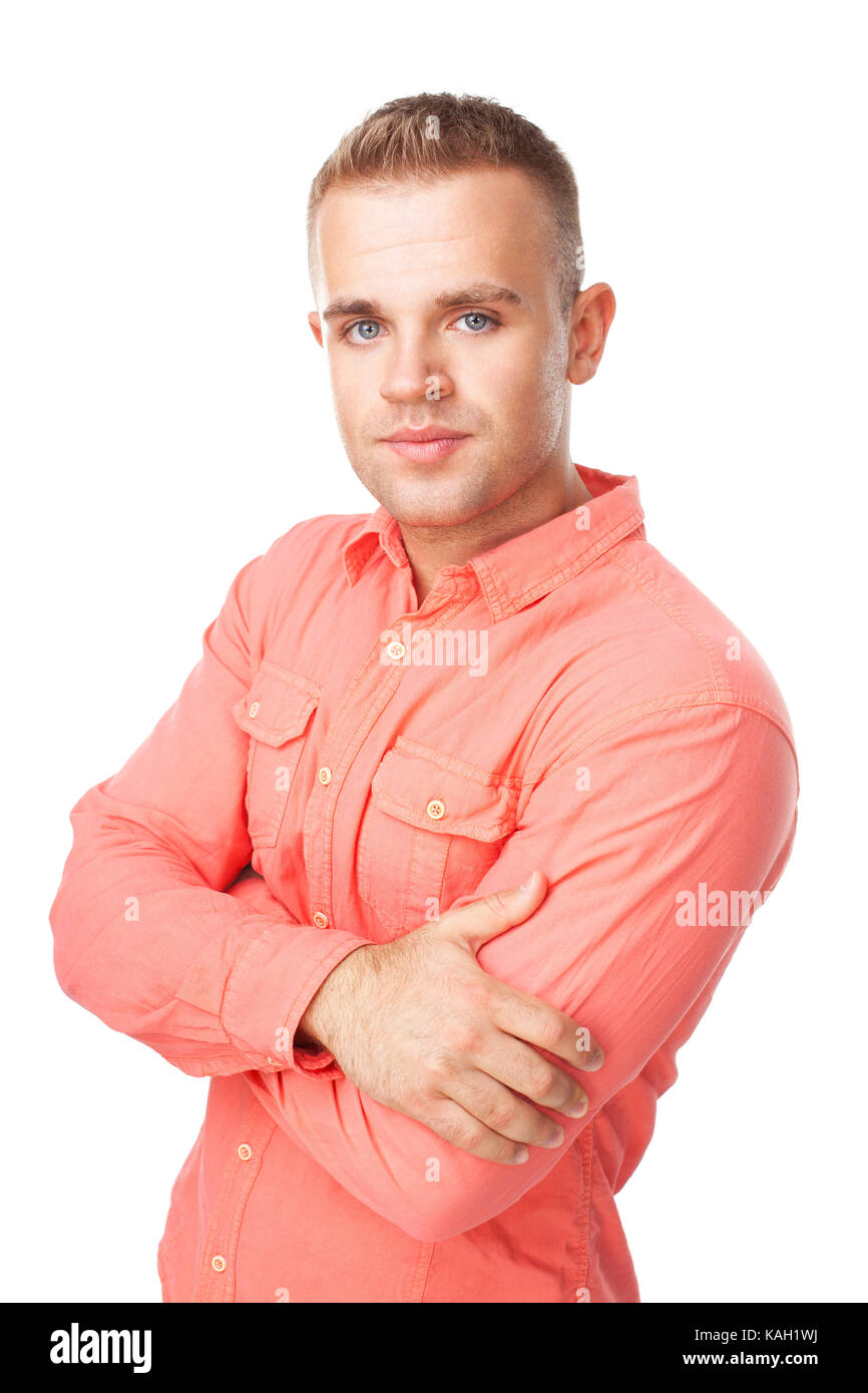 Portrait of happy smiling young man holding hand jusqu'à menton avec bras croisés isolé sur fond blanc Banque D'Images