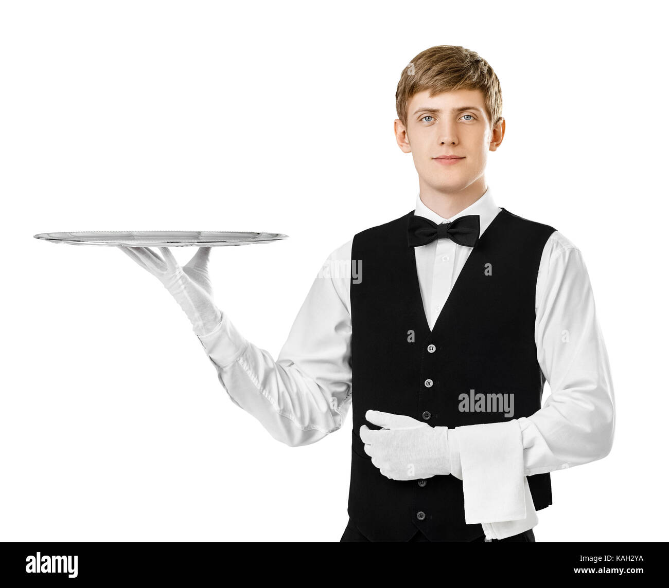 Portrait of young handsome waiter holding bac vide isolé sur fond blanc Banque D'Images