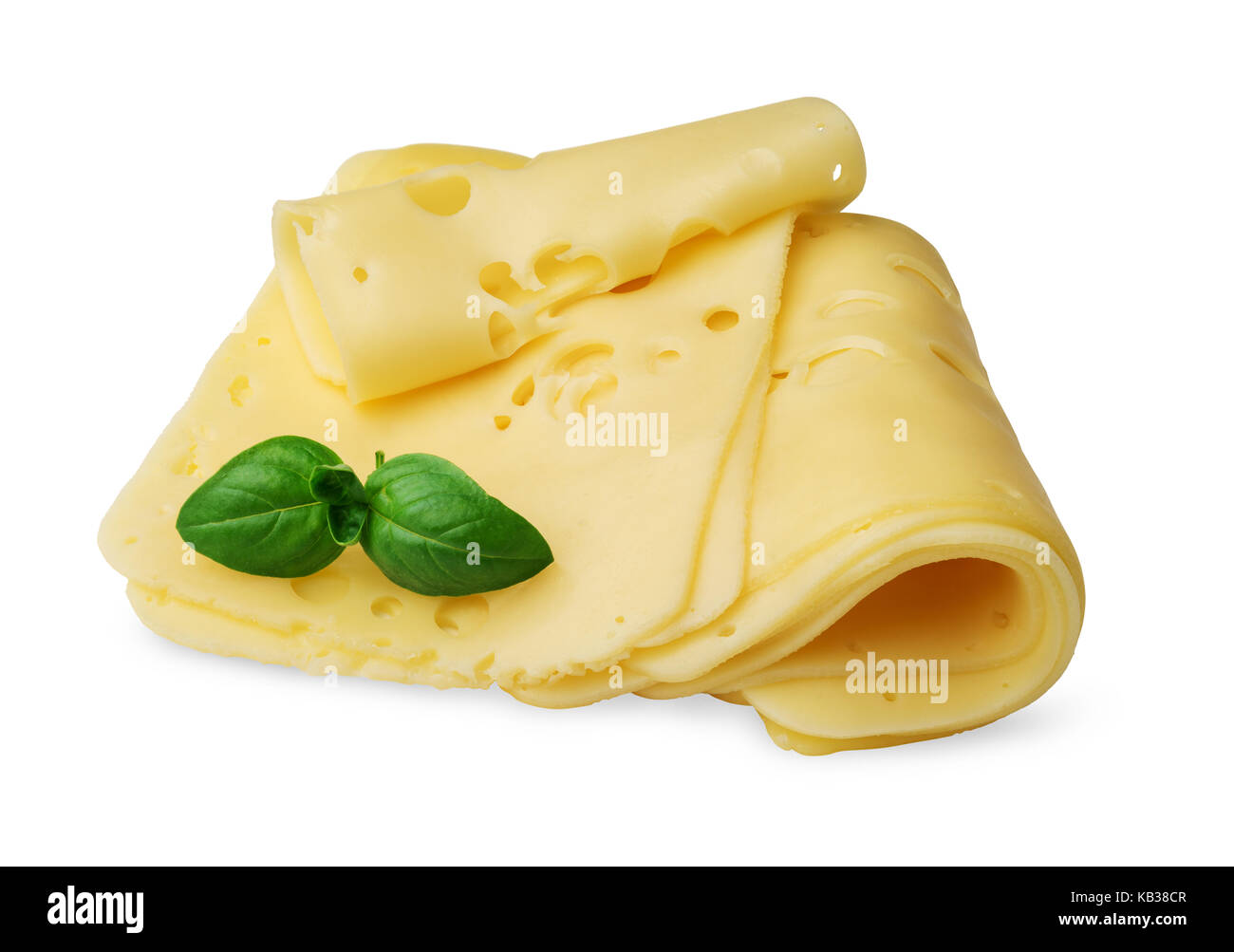 Quelques tranches de fromage avec des feuilles de basilic isolé sur fond blanc Banque D'Images
