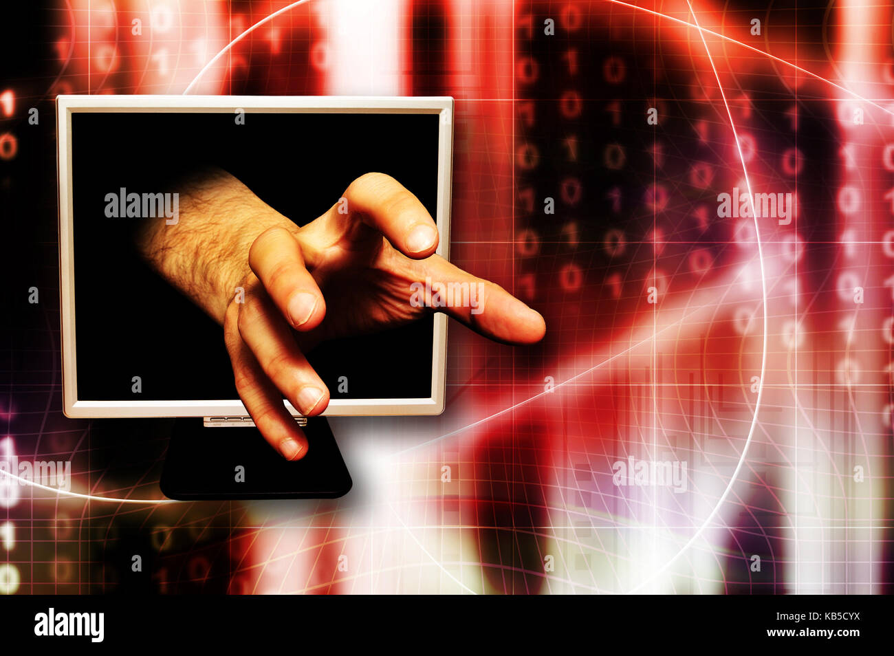 La main qui sort de l'écran d'un ordinateur comme pour attraper quelque chose, le vol d'identité et de la criminalité sur internet concept Banque D'Images