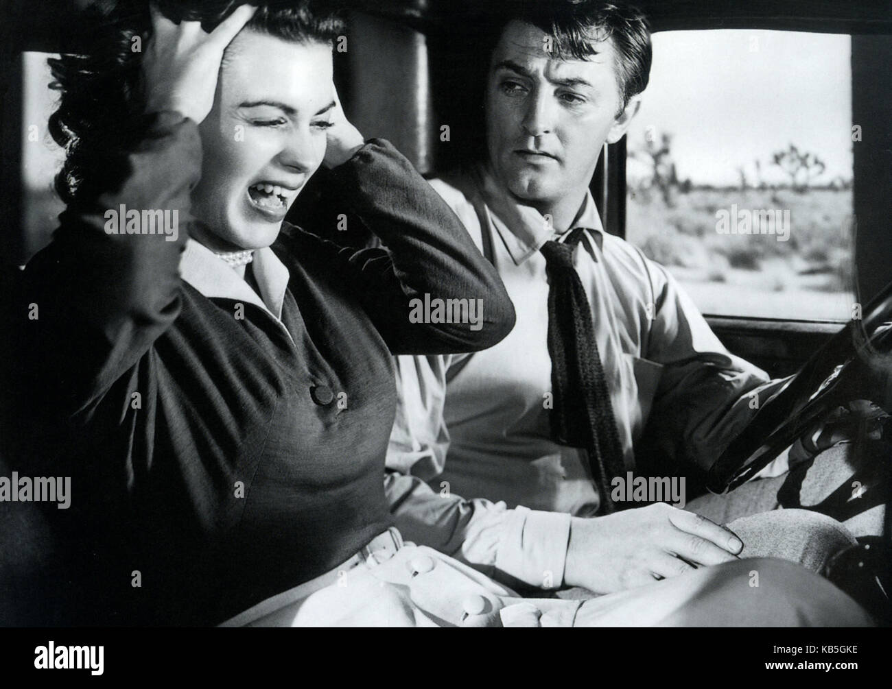 Où DANGER VIT 1950 RKO radio Photos film avec Robert Mitchum et foi Domergue Banque D'Images