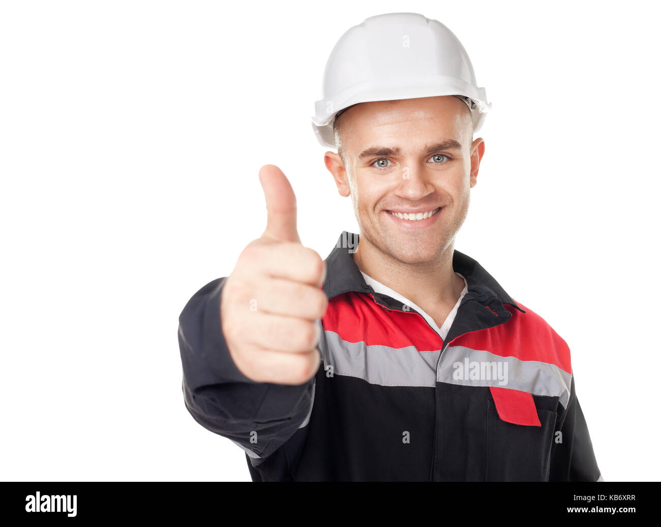 Portrait of young smiling ingénieur avec thumb up isolé sur fond blanc Banque D'Images