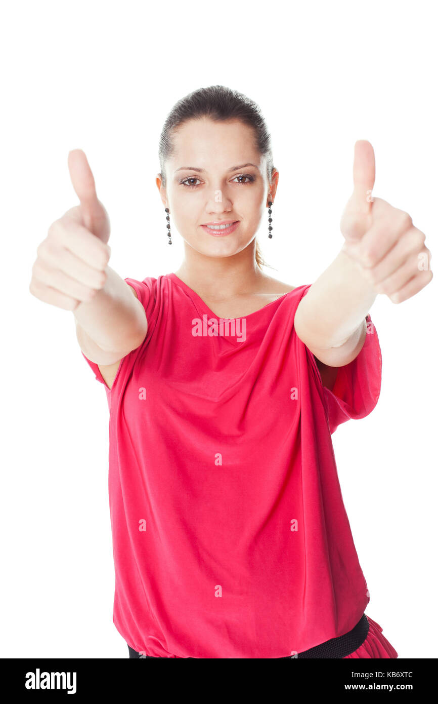 Portrait de jeune femme en robe rouge showing Thumbs up isolé sur fond blanc Banque D'Images