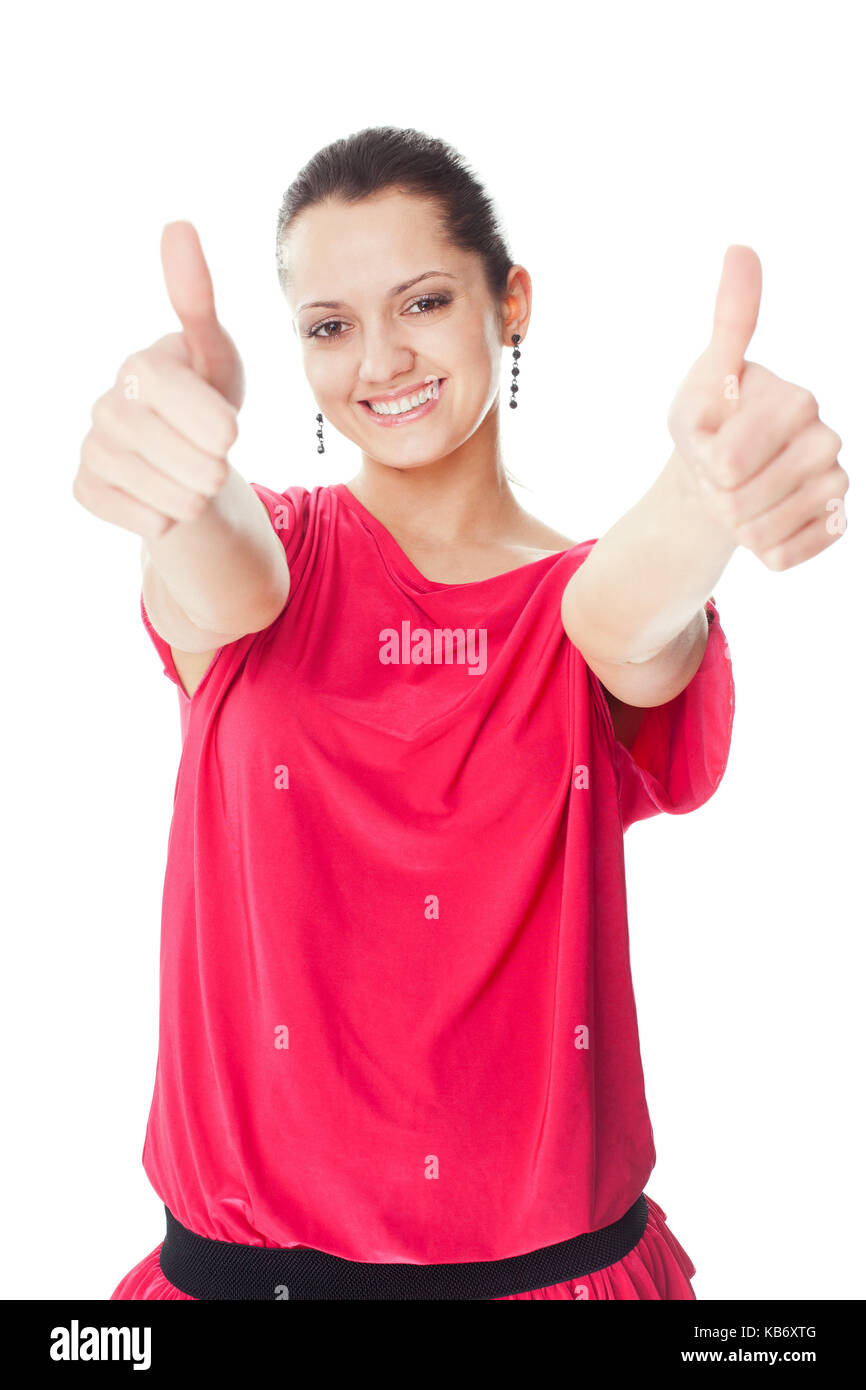 Portrait de jeune femme en robe rouge showing Thumbs up isolé sur fond blanc Banque D'Images