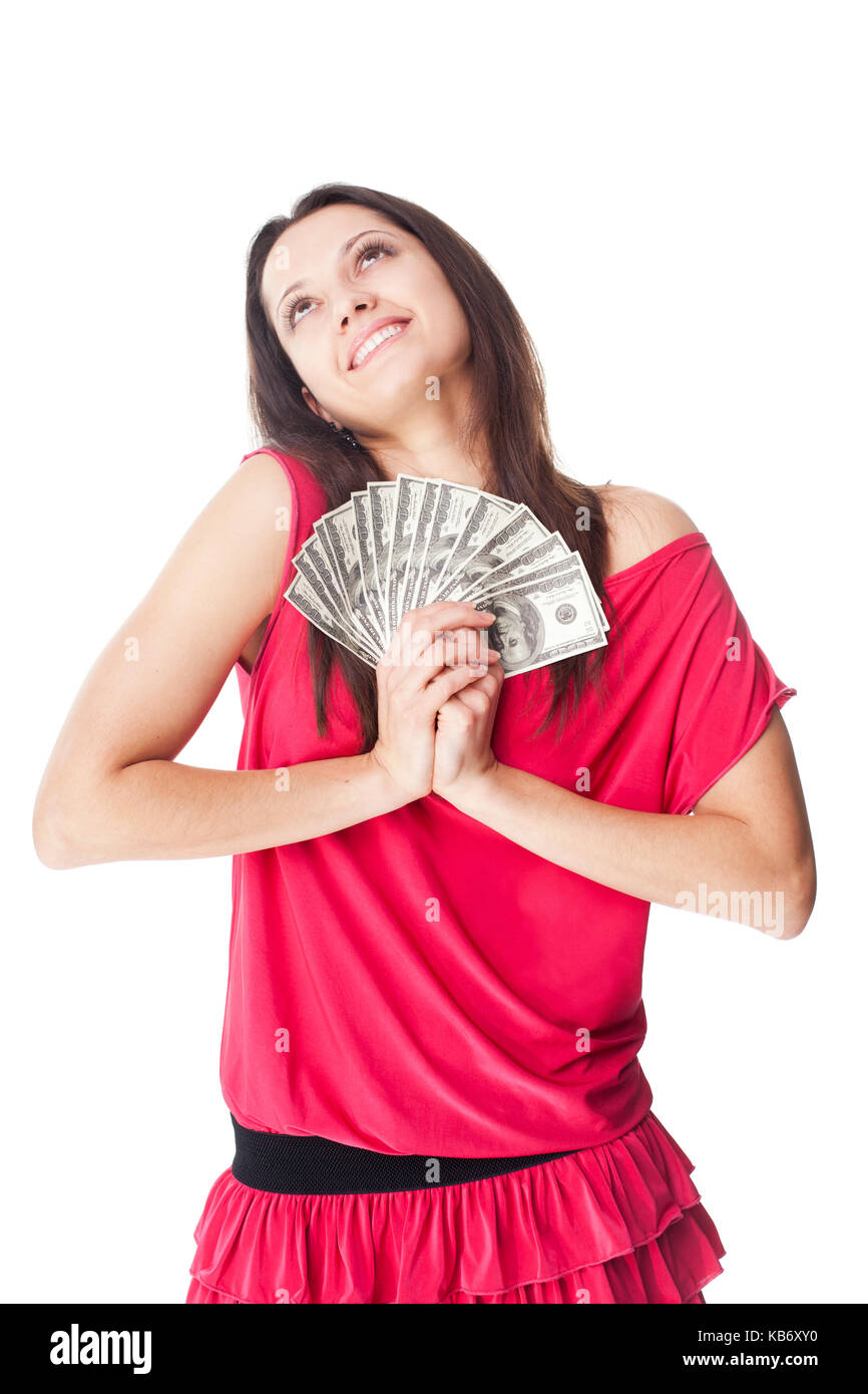 Portrait de jeune femme souriante holding cash, rêvant et regardant vers le haut, isolé sur fond blanc Banque D'Images